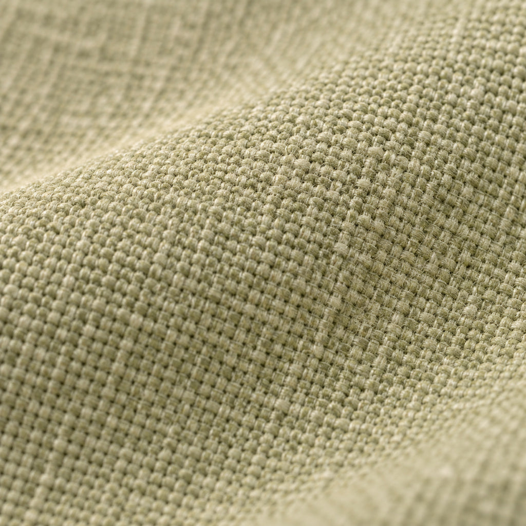 Coussin de sol rond épais aspect lin, déhoussable, gros plan sur la matière, coloris Vert amande