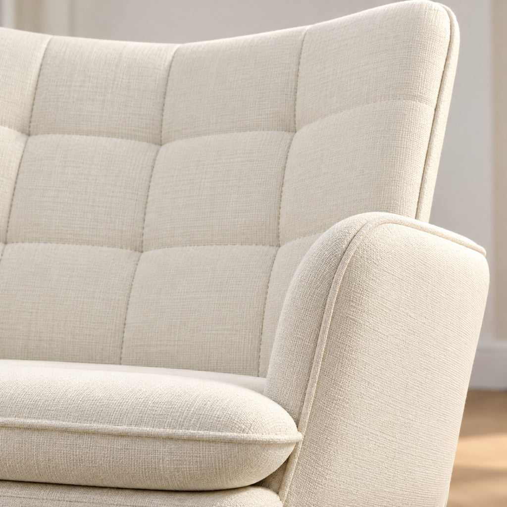Fauteuil à bascule effet lin, à oreilles, avec repose-pieds, gros plan sur la matière, coloris Crème
