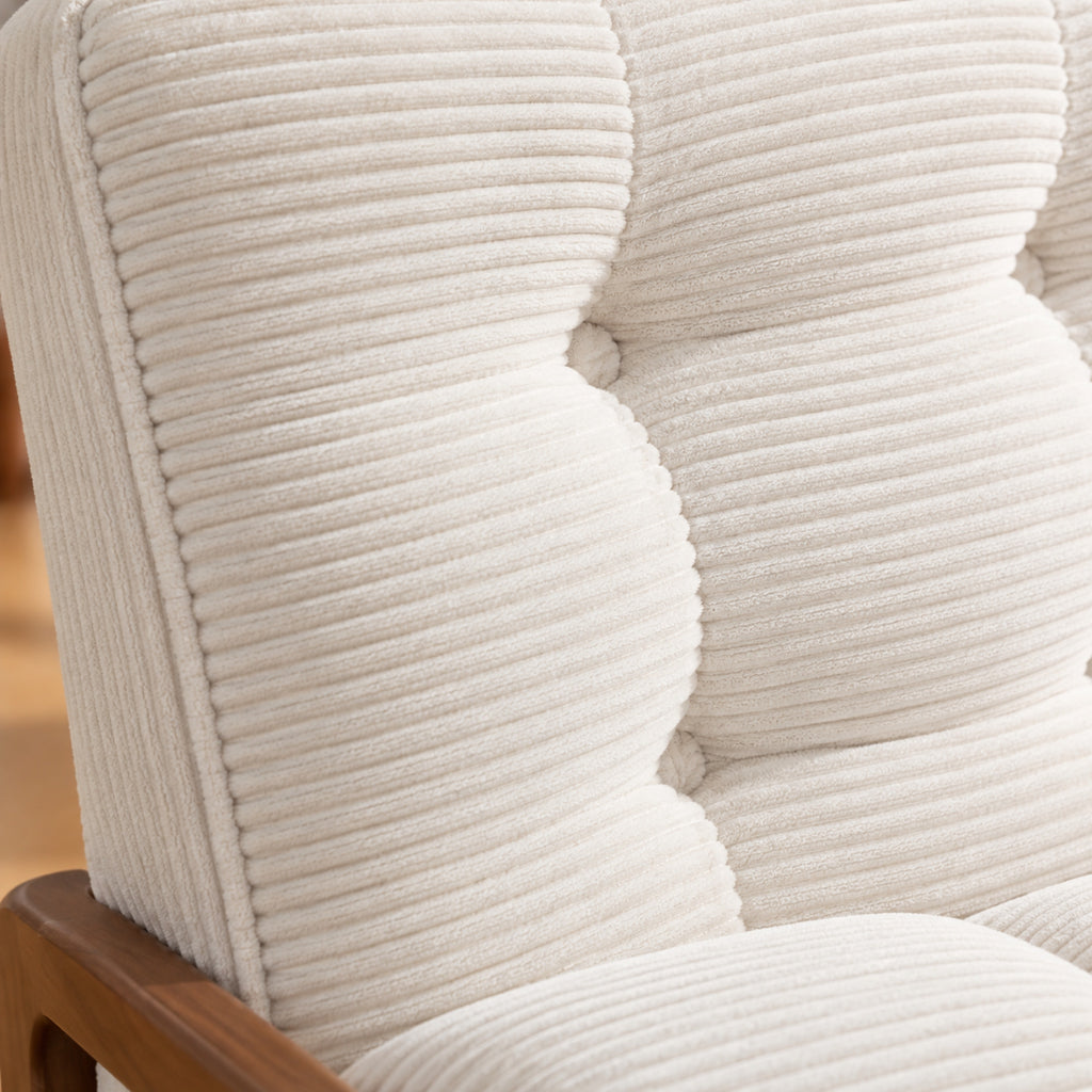 Fauteuil à bascule en velours côtelé, repose-pieds intégré, gros plan sur la matière