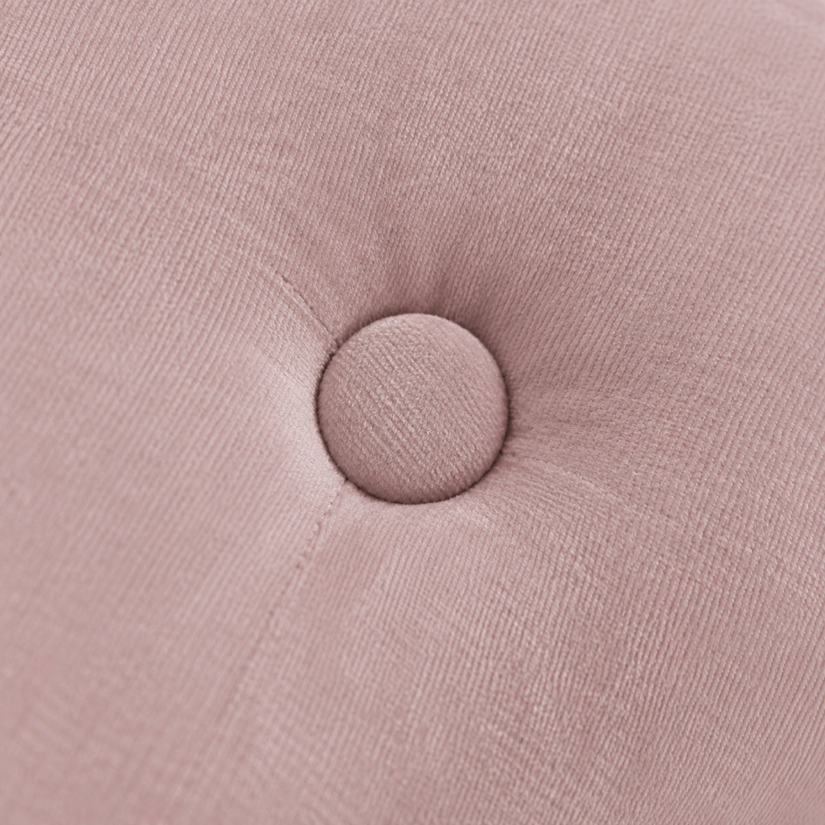 Fauteuil enfant en velours rose avec pouf assorti, gros plan sur la matière